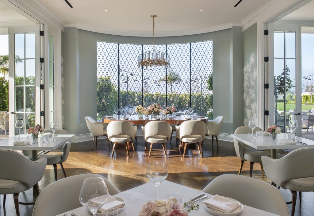 The elegant Revere Room features Gracie wallpaper in hand-painted chinoiserie blue